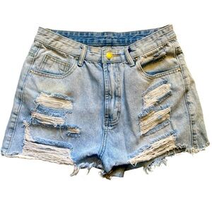 Composition Size M ladies distressed jean shorts.